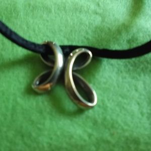 An James Avery Sterling Cross Silk Cord Necklace.
